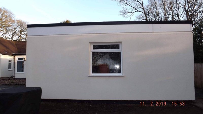 4 wide of building after soft washing treatment